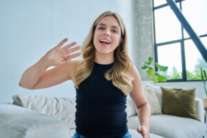 Web cam view of young woman talking looking in camera, online meeting, video call - WorldTone